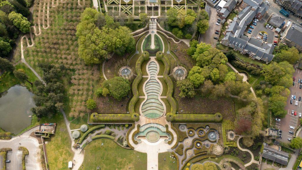 View of Alnwick Gardens with abundant green spaces