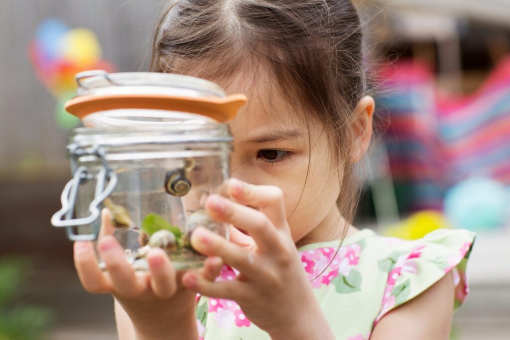 May Half-term in Northumberland - County Show - girl studying insects