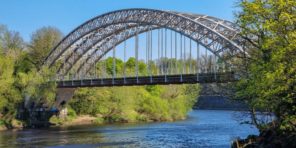 Wylam Railway bridge over the Tyne on a sunny day near Newcastle, England